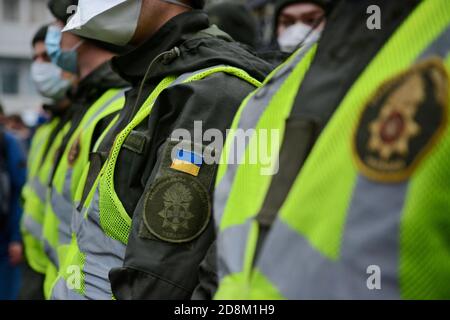 Kiev, Ukraine. 30th Oct, 2020. Riot police stand on guard outside the Constitutional Court building during the protest.Hundreds of protesters gathered outside the Constitutional Court of Ukraine building after its decision to cancel the electronic declaration by officials. The protesters demand the judges to come out and explain to them the reasons for their ruling. Credit: SOPA Images Limited/Alamy Live News Stock Photo