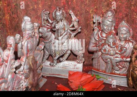 Small silver holly god statue on Worship room Stock Photo