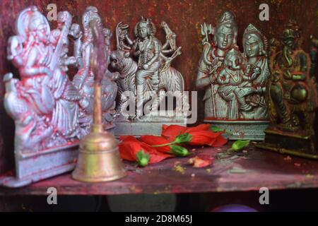 Small silver holly god statue on Worship room Stock Photo
