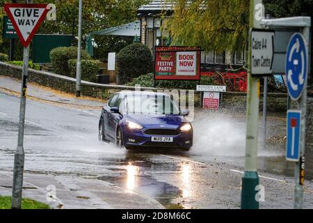 Chippenham, Wiltshire, UK. 31st October, 2020. As heavy showers affect many parts of the UK, drivers are pictured braving very heavy rain in Chippenham, Wiltshire. Credit: Lynchpics/Alamy Live News Stock Photo