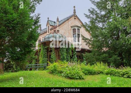 Editorial: BAD ISCHL, UPPER AUSTRIA, AUSTRIA, August 14, 2020 - The Marble Castle emerging from behind the trees in the park of the imperial villa Stock Photo