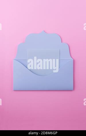 The blue envelope is a letter. The envelope is open and we see a blue note on which you can write any message, for example romantic. Stock Photo