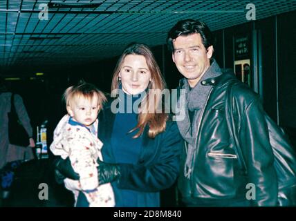 Pierce Brosnan with girlfriend Keeley Shaye-Smith and son Dylan 1997 arriving at Heathrow Airport for the premiere of James Bond 'Tomorrow never Dies' Stock Photo