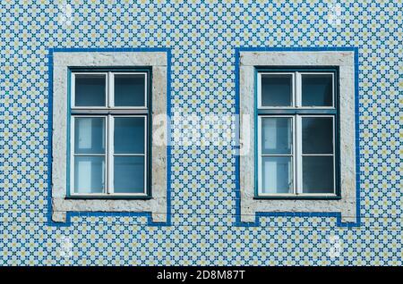 Lisbon windows with typical portuguese tiles on the wall Stock Photo