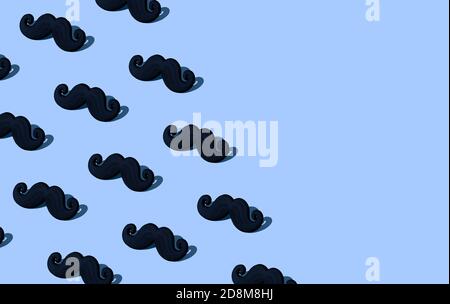 Black mustache pattern on a blue background with place for inscription. Hard light. Prostate cancer awareness concept composition. Stock Photo