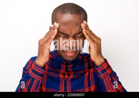 Close up portrait of young african man with headache and fingers pressing against head Stock Photo