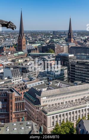View east from St. Nikolai Memorial in Hamburg, showing St. Peter's Church (left) and St. Jacobi Church (right). Stock Photo