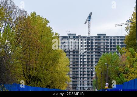 Modern building under construction against blue sky Stock Photo