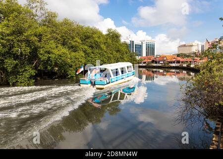 MALACCA, MALAYSIA, October 31, 2020: Melaka river cruise offer tourist a glimpse of historic city with historical buildings. Stock Photo