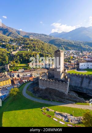 Aerial view of the medieval Bellinzona castles, Unesco World Heritage site, in autumn at sunset. Canton Ticino, Switzerland. Stock Photo