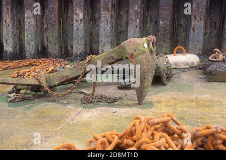 Very old ships anchor rusted and left in shipyard Stock Photo