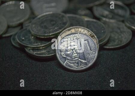 close up image of a pile of Philippine Peso coins under President Rodrigo Duterte's Presidential Management Stock Photo