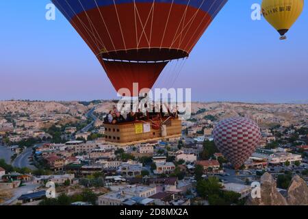 Tourists in hot air balloon fly close in Cappadocia, Turkey Stock Photo