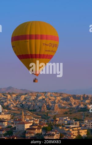 Lonely hot air balloon fly in the morning over Goreme in Cappadocia, Turkey Stock Photo