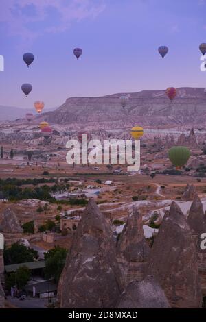 Hot air balloons over the Goreme valley at sunrise, Cappadocia, Turkey Stock Photo