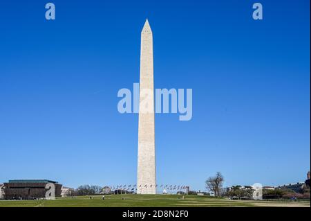 Washington monument viewed from National Mall during spring 2019. At 169 meters it was the tallest building in the world until the Eiffel tower. Stock Photo
