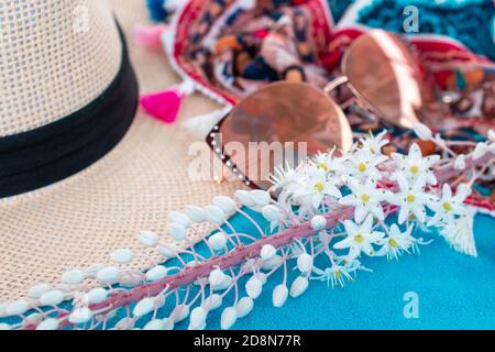 summer vacation by the sea concept. Frame accessories travel on vacation. composition with beach accessories on blue beach towel Stock Photo