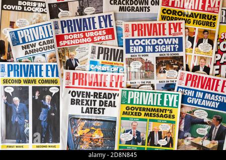 A collection of Private Eye news and current affairs magazine front covers showing recent UK headlines on Brexit and Covid-19 Stock Photo