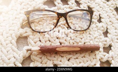 Fountain pen notebook and glasses in composition in soft light Stock Photo