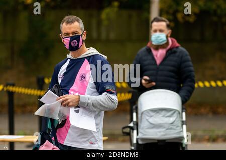 Dulwich Hamlet supporters wearing face masks as they enter Champion Hill Stadium for a Women's Football match. Stock Photo