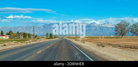Guadalupe mountains in distance as viewed from car on the road. Stock Photo
