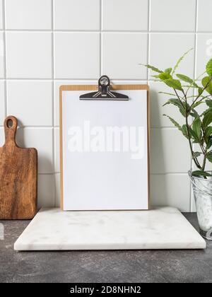 Cutting board with menu sheet of paper on rustic wooden planks