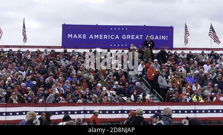 Pennsylvania, USA. 31st Oct, 2020. (NEW) US President Donald Trump Takes His Campaign to Reading, Pennsylvania. October 31, 2020, Reading Regional Airport, Reading, PA, USA: Appearing before large crowds on their political home base, Pennsylvania's Republican Congressmen Dan Meuser and Lloyd Schmuker deliver rousing introductions of US President Donald Trump to their enthusiastic constituents as large and supportive Pennsylvania crowds gather to meet President Donald Trump, as his schedule of cross-country rallies intensifies during the uptick to the conclusion of an epic electoral campaign Stock Photo