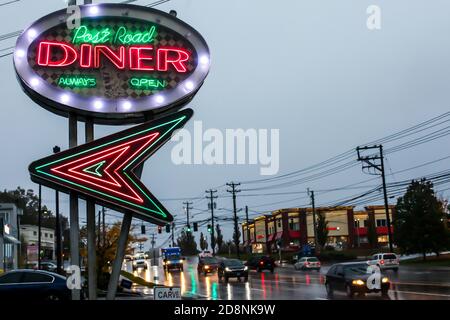 NORWALK, CT, USA-OCTOBER 30, 2020: Postal Road Diner in rainy October morning with street traffic lights on Connecticut Avenue Stock Photo