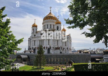 = Christ the Redeemer Cathedral Framed by Trees in Summer =  View from Volhonka street on the Cathedral of the Christ the Savior (the Redeemer) and a Stock Photo