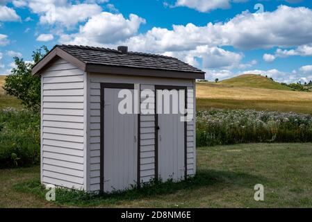 Double Outhouse at Custer House in Fort Abraham Lincoln State Park in North Dakota Stock Photo