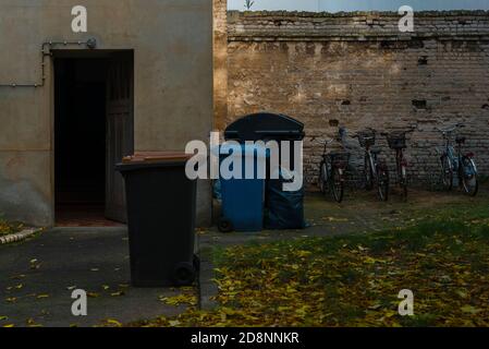 Garbage place in a backyard, garbage cans in a Berlin backyard Stock Photo