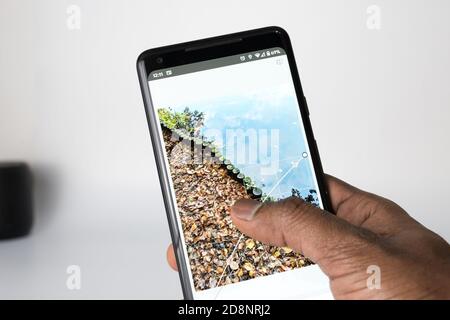 Person editing photo on smartphone Stock Photo