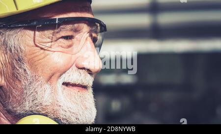 Senior factory worker or engineer close up portrait in factory . Industry and engineering concept . Stock Photo