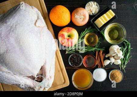 Maple Cider Bourbon Brined Turkey with Bourbon Gravy Ingredients: Raw turkey and the ingredients used to make a brine and gravy with it Stock Photo