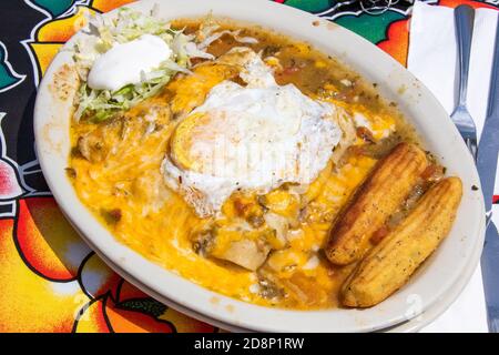 Green Chile Chicken Enchiladas, Coyote Cafe and Rooftop Cantina Mexican Restaurant, Santa Fe, NM, USA Stock Photo