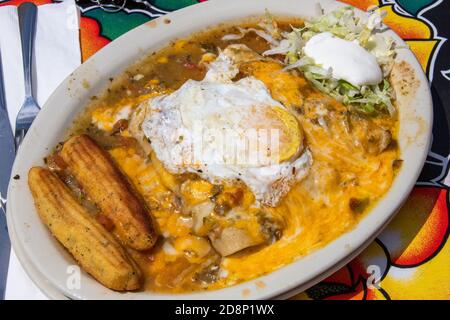 Green Chile Chicken Enchiladas, Coyote Cafe and Rooftop Cantina Mexican Restaurant, Santa Fe, NM, USA Stock Photo