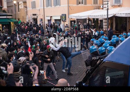 Rome, Italy. 31st Oct, 2020. Moments of clashes of the demonstrators with the police at Campo de Fiori in Rome (Photo by Matteo Nardone/Pacific Press) Credit: Pacific Press Media Production Corp./Alamy Live News Stock Photo