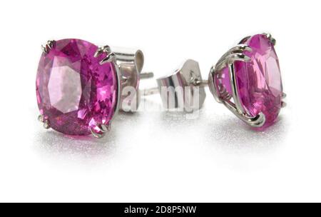 Stern magenta and silver stud earrings photographed on a white background photographed on a white background Stock Photo