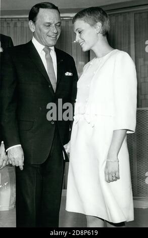 July 19, 1966 - Las Vegas, Nevada - FRANK SINATRA, 50, left, holds hands with his new bride, MIA FARROW, 21, at their wedding. (Credit Image: © Keystone Press Agency/Keystone USA via ZUMAPRESS.com) Stock Photo