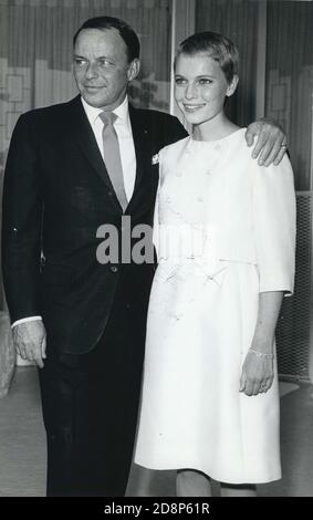 July 19, 1966 - Las Vegas, Nevada - FRANK SINATRA, 50, left, puts his arm around his new bride, MIA FARROW, 21, at their wedding. (Credit Image: © Keystone Press Agency/Keystone USA via ZUMAPRESS.com) Stock Photo