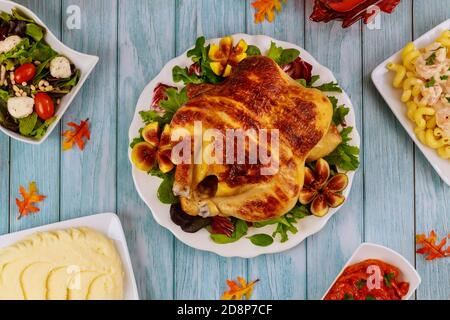 Dinner table for Thanksgiving Day. Turkey, chicken, garnish Top view Stock Photo