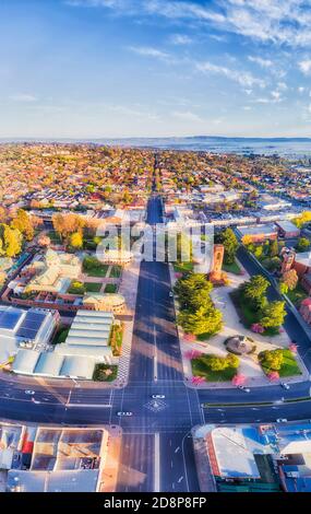 Streets and downtown with local parks in Bathurst city around historic courthouse and Bathurst regional council - aerial vertical panorama. Stock Photo