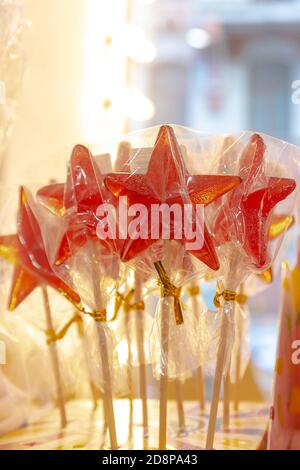 red caramel in the form of stars on a stick Stock Photo