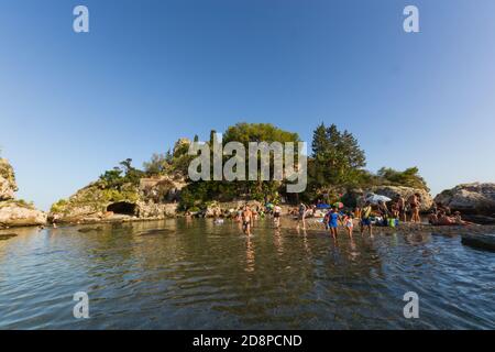 TAORMINA, ITALY - Aug 29, 2020: Taormina, Sicily, south Italy - August 27 2020 -  Crowded  the famus Isola Bella in Taormina. Stock Photo