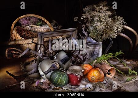 Old violin, chair and flowers on a canvas background Stock Photo