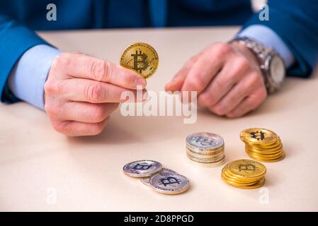 Man earning money via Internet in cryptocurrency concept Stock Photo