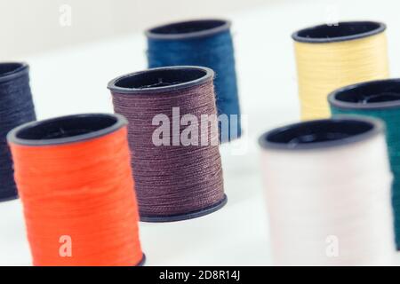 Spools of colorful thread as accessories for using in sewing and needlework Stock Photo