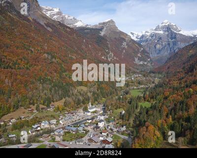 AERIAL VIEW. The sparsely populated Giffre Valley looking upstream towards the 2989-meter-high Tenneverge Peak. Sixt-Fer-à-Cheval, France. Stock Photo