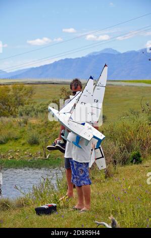 Model yacht enthusiasts with their boats. Stock Photo