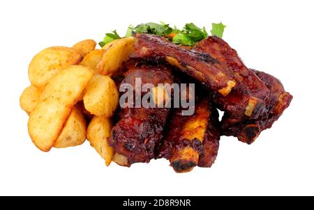 Mini barbecue pork ribs and potato wedges meal with salad isolated on a white background Stock Photo
